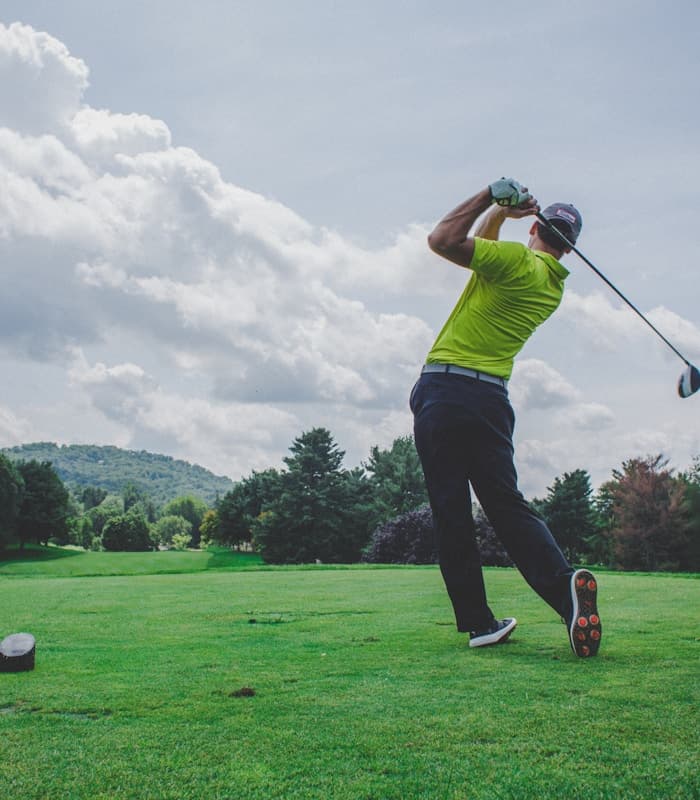Golfer on a beautiful fairway at sunrise